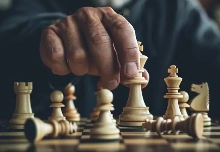 This may contain: a man is playing chess with his hand